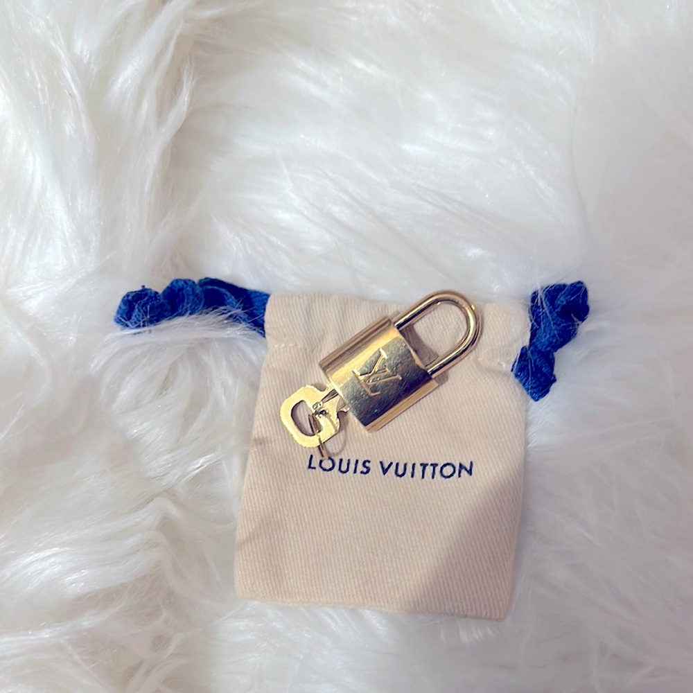 Louis Vuitton Gold Padlock luxury item